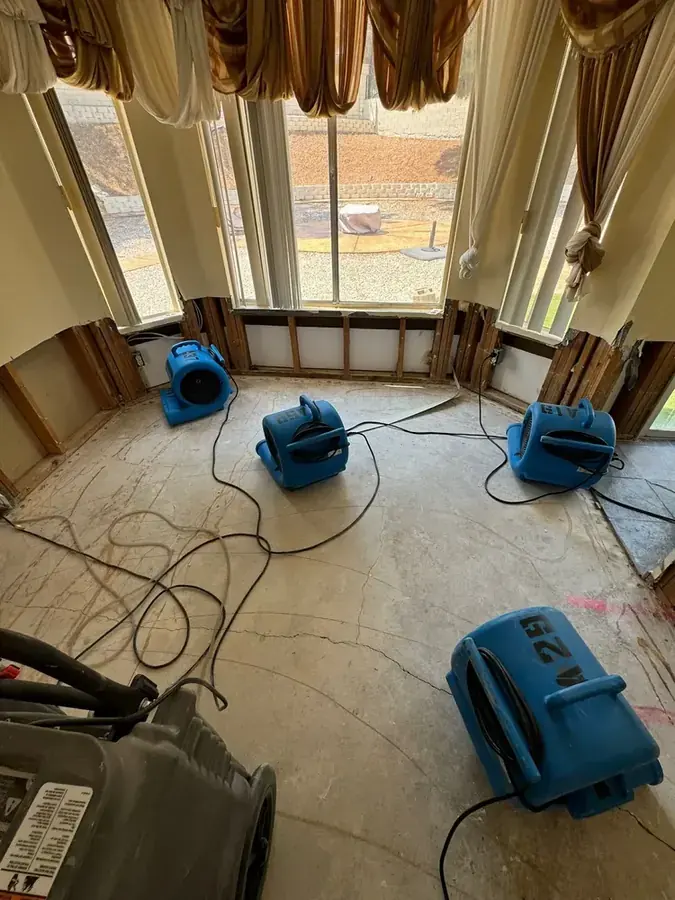 A dehumidifier running during a dry-out in an Inglewood, CA home