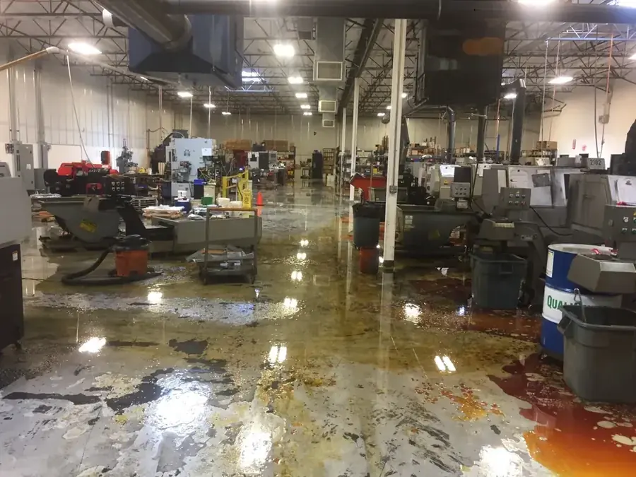 Restoration technician drying a flooded Inglewood, CA home with air movers